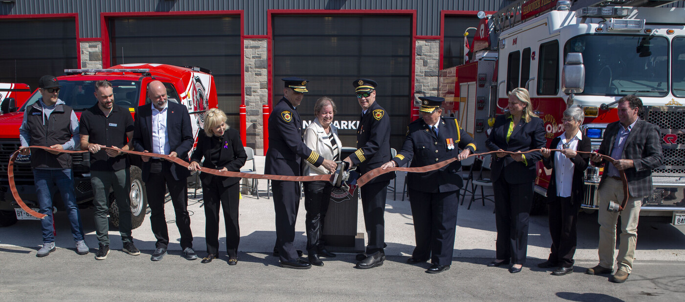 Group of people and dignitaries at ribbon cutting for Hanover's net-zero fire hall 