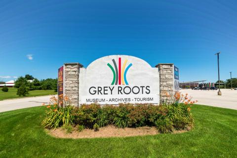 Grey Roots Welcome Sign in Summer