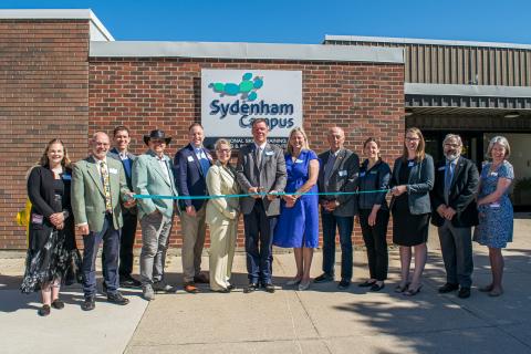 Delegates cut the ribbon at the grand opening of the Sydenham Campus in Owen Sound.