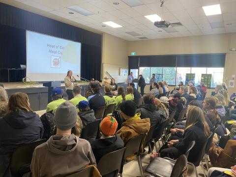 Elementary teacher Hilary Coburn speaks to a group of students